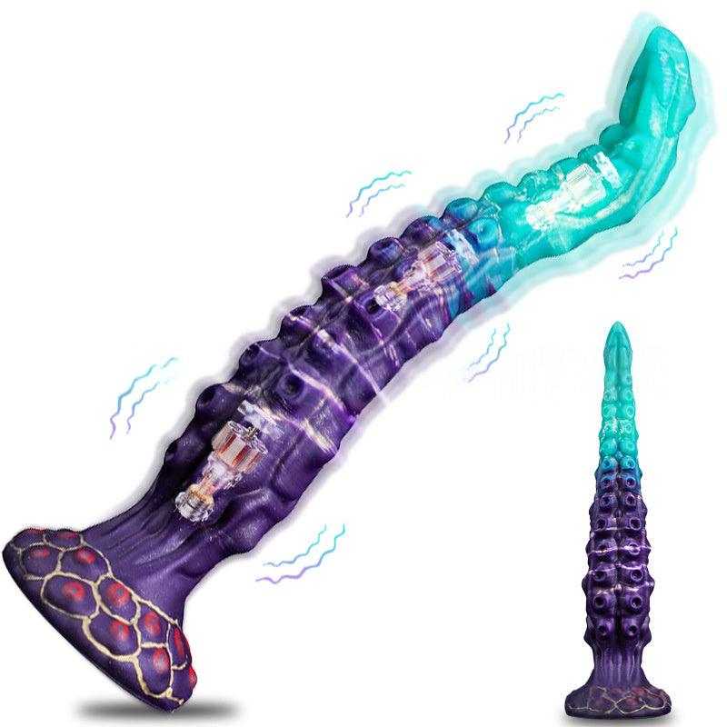 Estimulador Íntimo Extralargo de silicona en tonos morado y turquesa, con relieves, base ancha y función vibratoria.