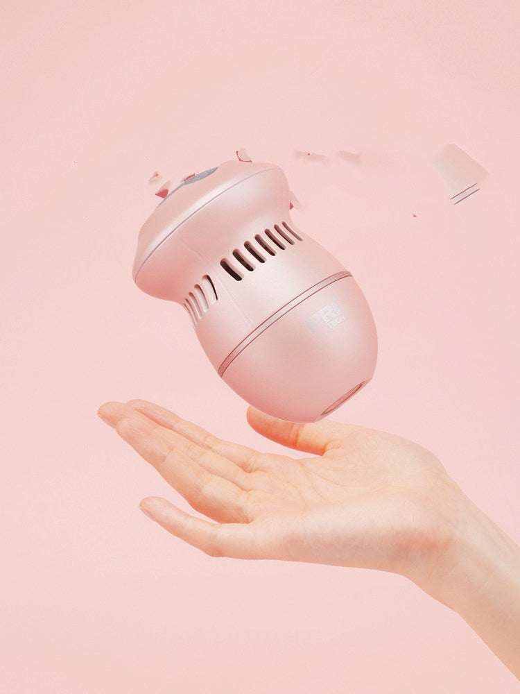 Lima eléctrica para pies rosa de plástico, con cuerpo ovalado, ranuras de ventilación y cabezal circular