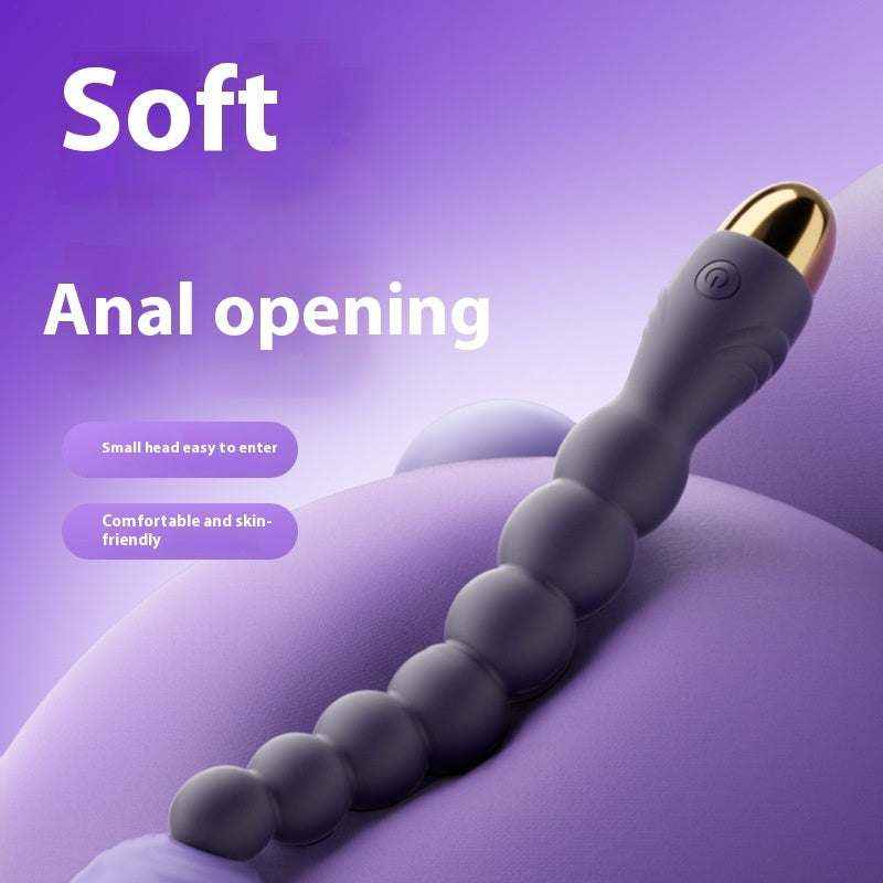 Vibrador de perlas Anales de silicona morada oscura, con cuentas redondeadas y punta pequeña dorada para inserción cómoda.