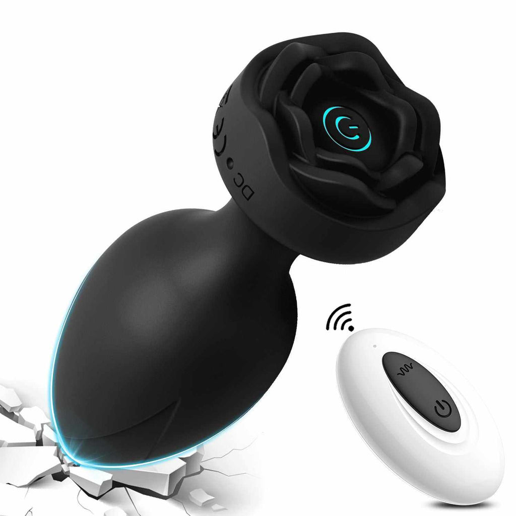 Vibrador para Mujer de silicona negra con detalles luminosos azules y control remoto blanco inalámbrico.